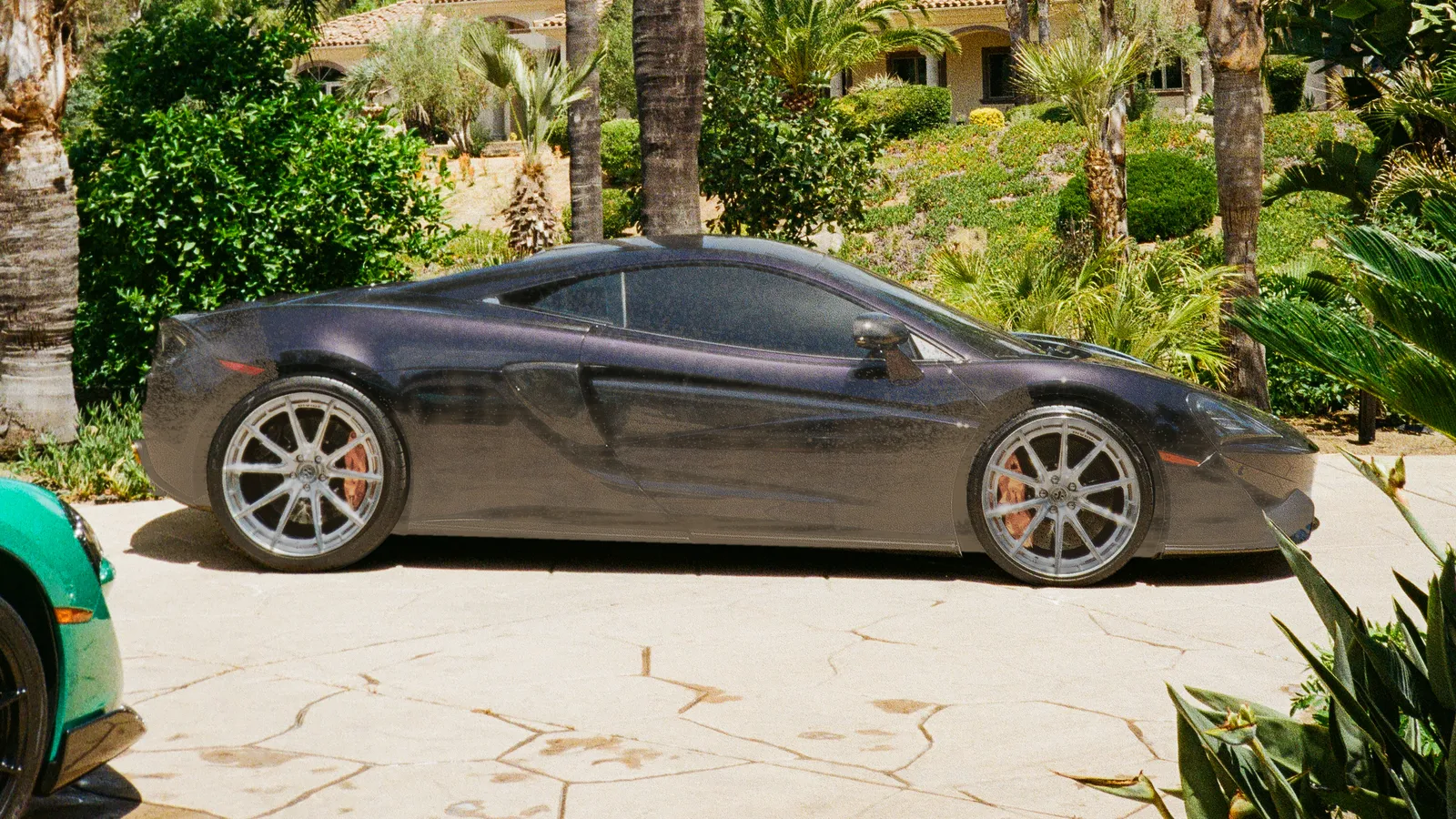 McLaren covered in road dust and grime before mobile detailing